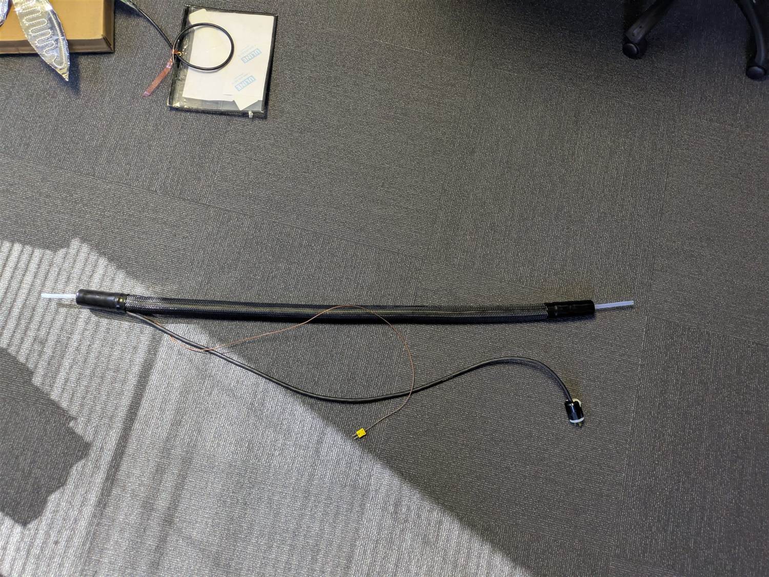 Finished heated line with braided sleeve, thermocouple, and power plug