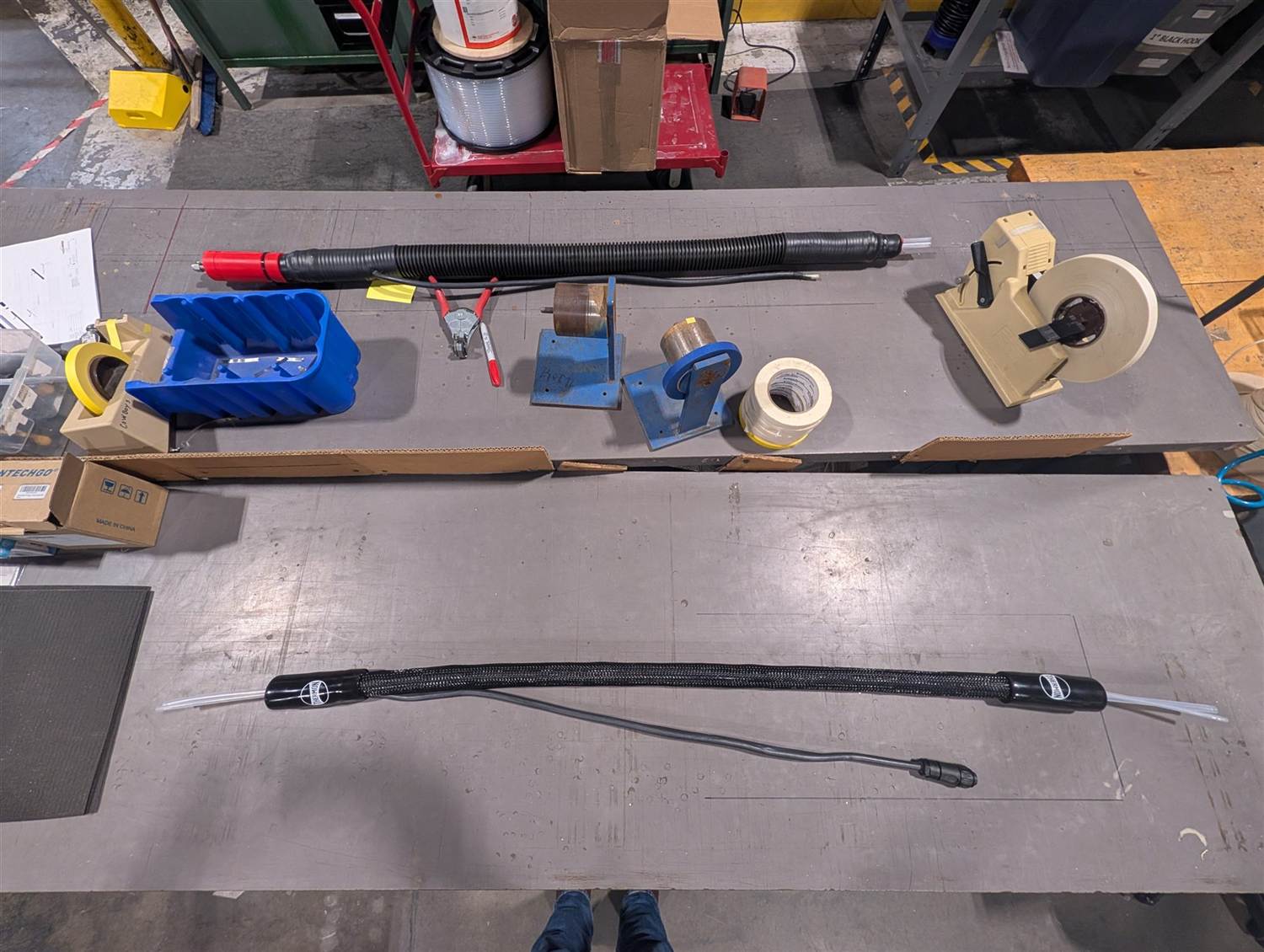Two completed heated lines staged on a workbench