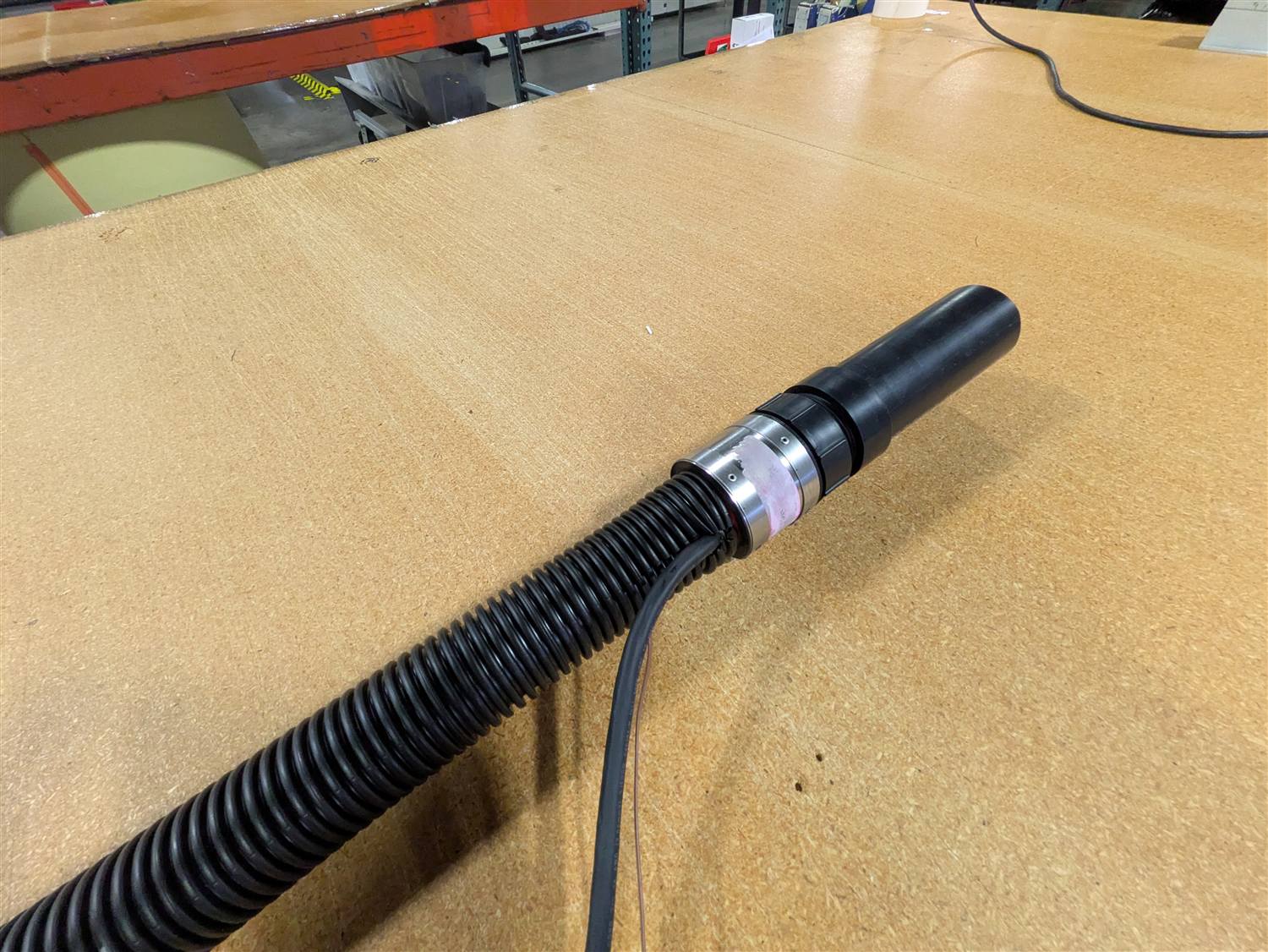 Corrugated jacket transitioning to a connector with power leads exiting