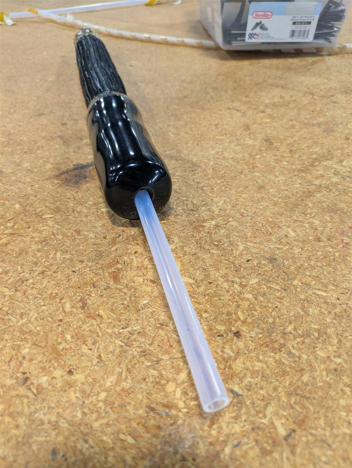 Glossy termination boot and braided sleeve on a portable test line